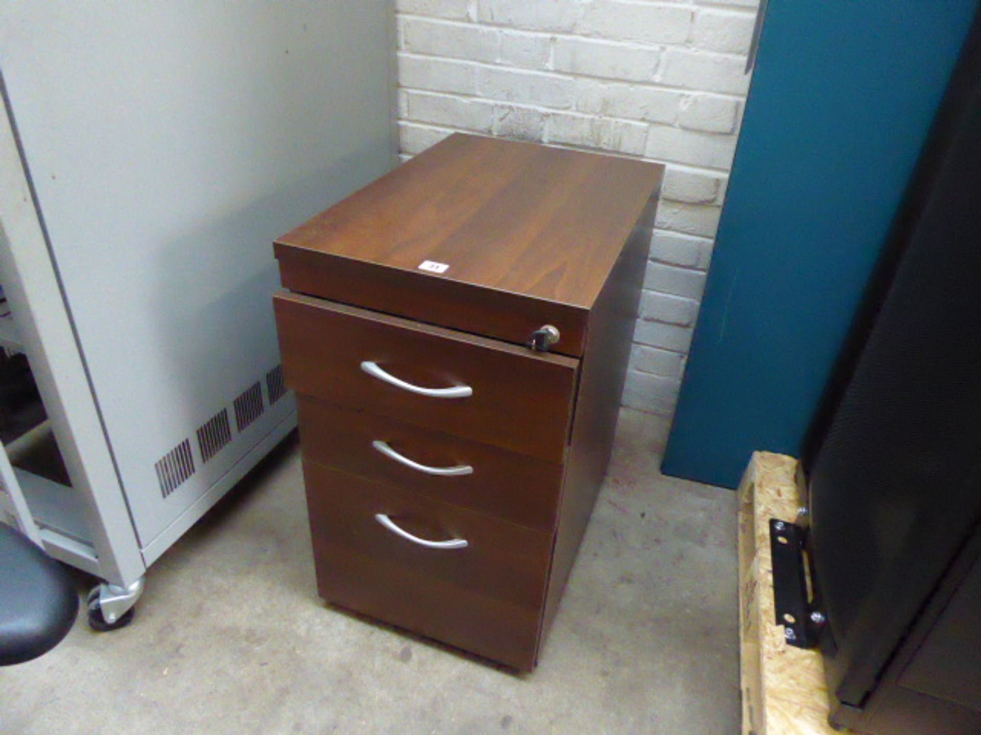 A 4 drawer mahogany effect filing cabinet