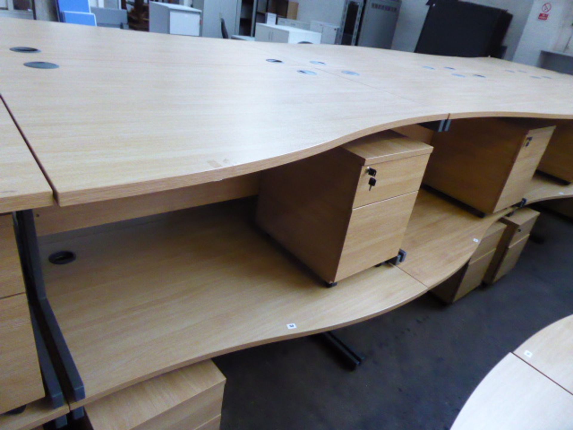 2 140cm light oak effect desks with a wave on cantilever legs and 2 matching pedestals with opposing