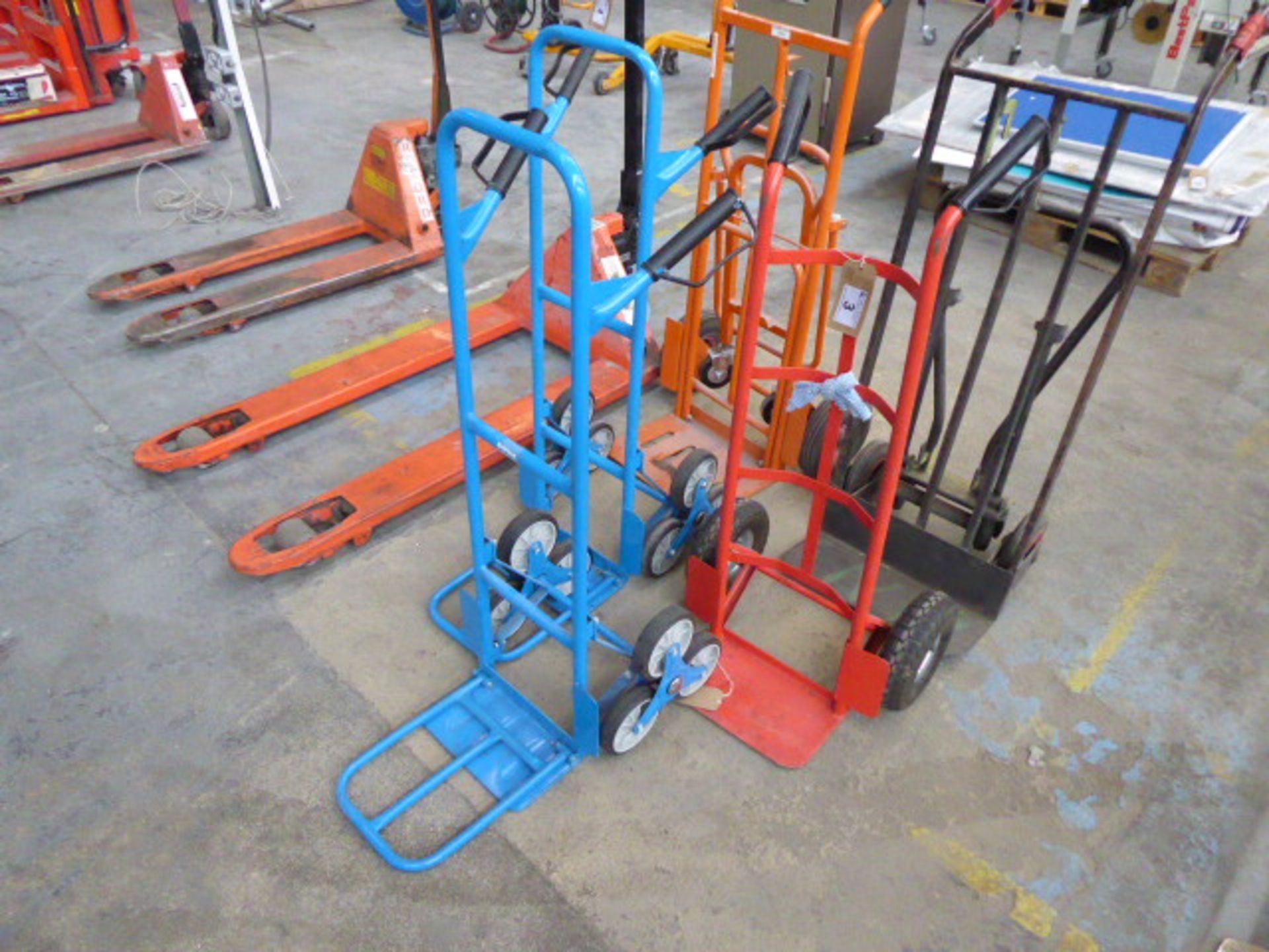 2 blue stair lifting sack barrows and 3 other various sack barrows