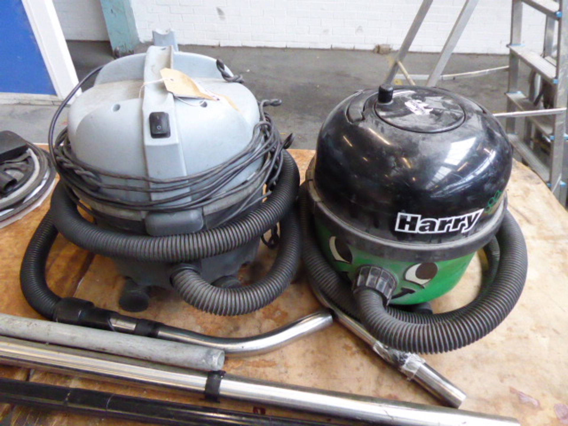 Henry and Nilfisk vacuum cleaners with tools plus a red Henry vacuum cleaner