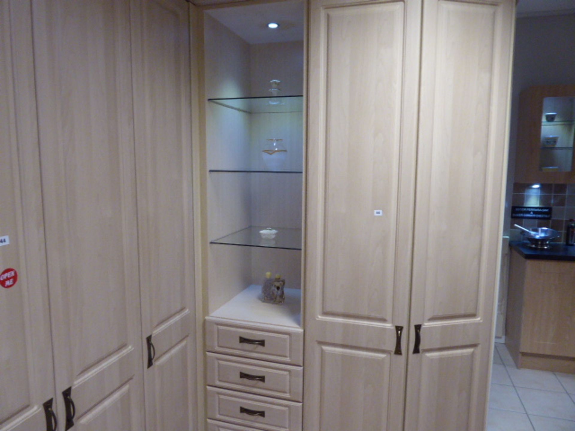 Small corner built in bedroom storage unit comprising of cupboards, drawers and open shelves. Max - Image 2 of 3