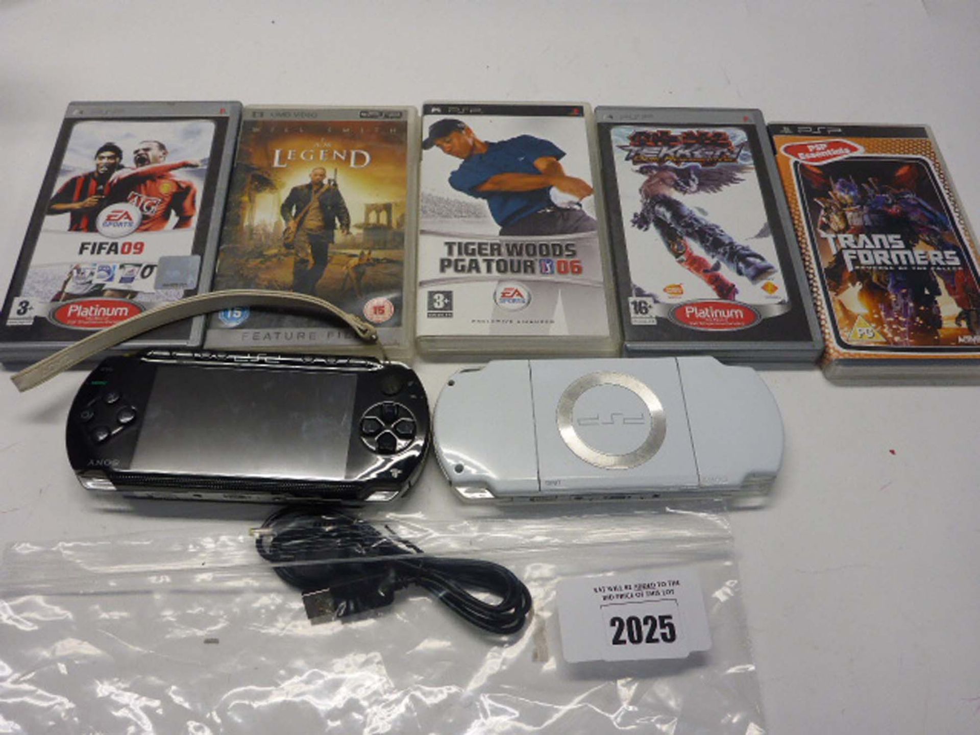 Two Sony Playstation portable consoles, with UMD video '' Legend'' and Four Games.