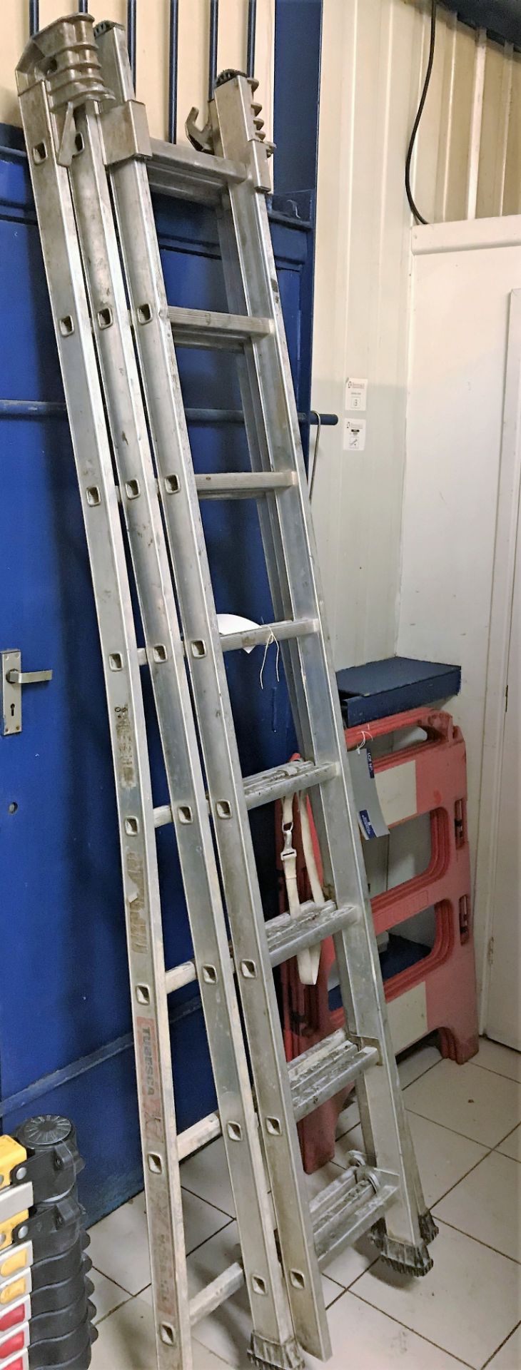 A Tubesca 24 rise Alloy Triple Extending Combination Ladder.