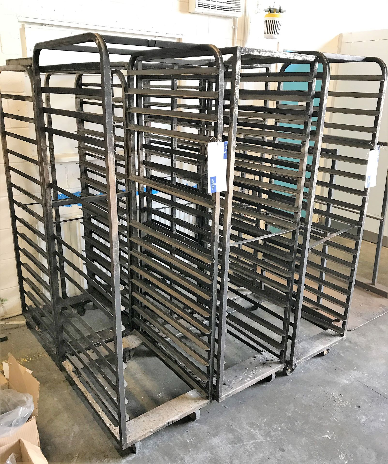 6 Multi Tier Mobile Bread Racks.