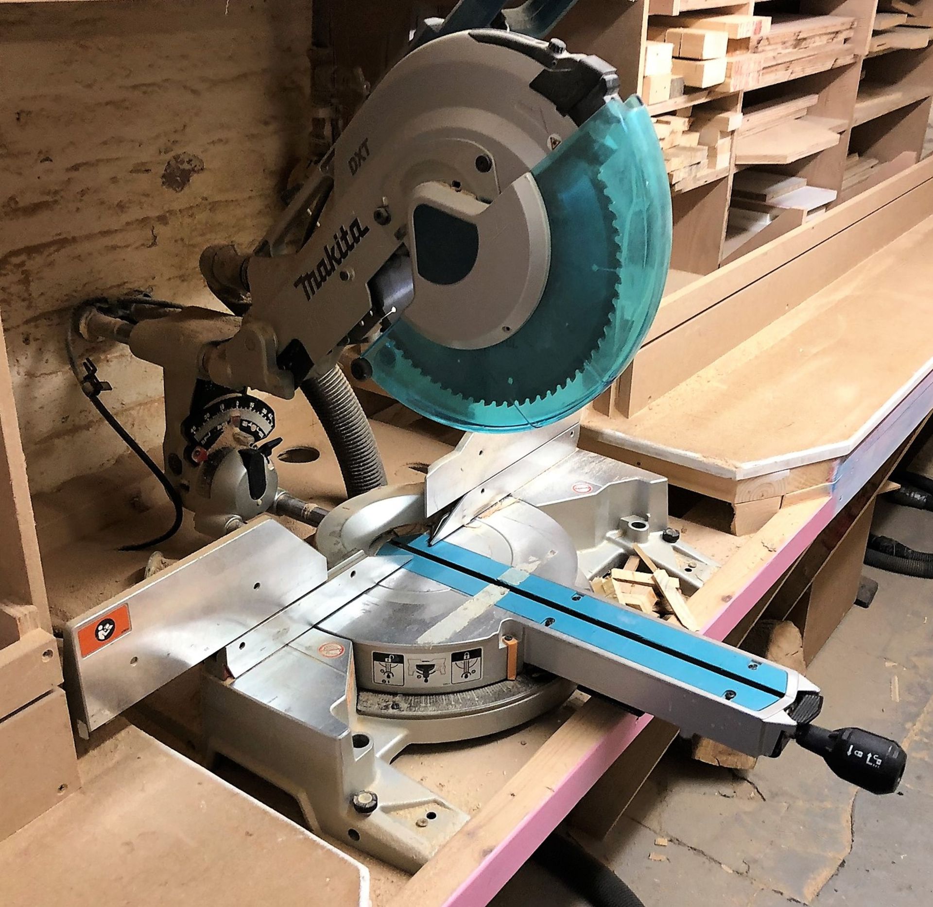 A Makita DXT Mitre Saw with rotating table and guard (240v)-held in store at Stoneywood Motors,