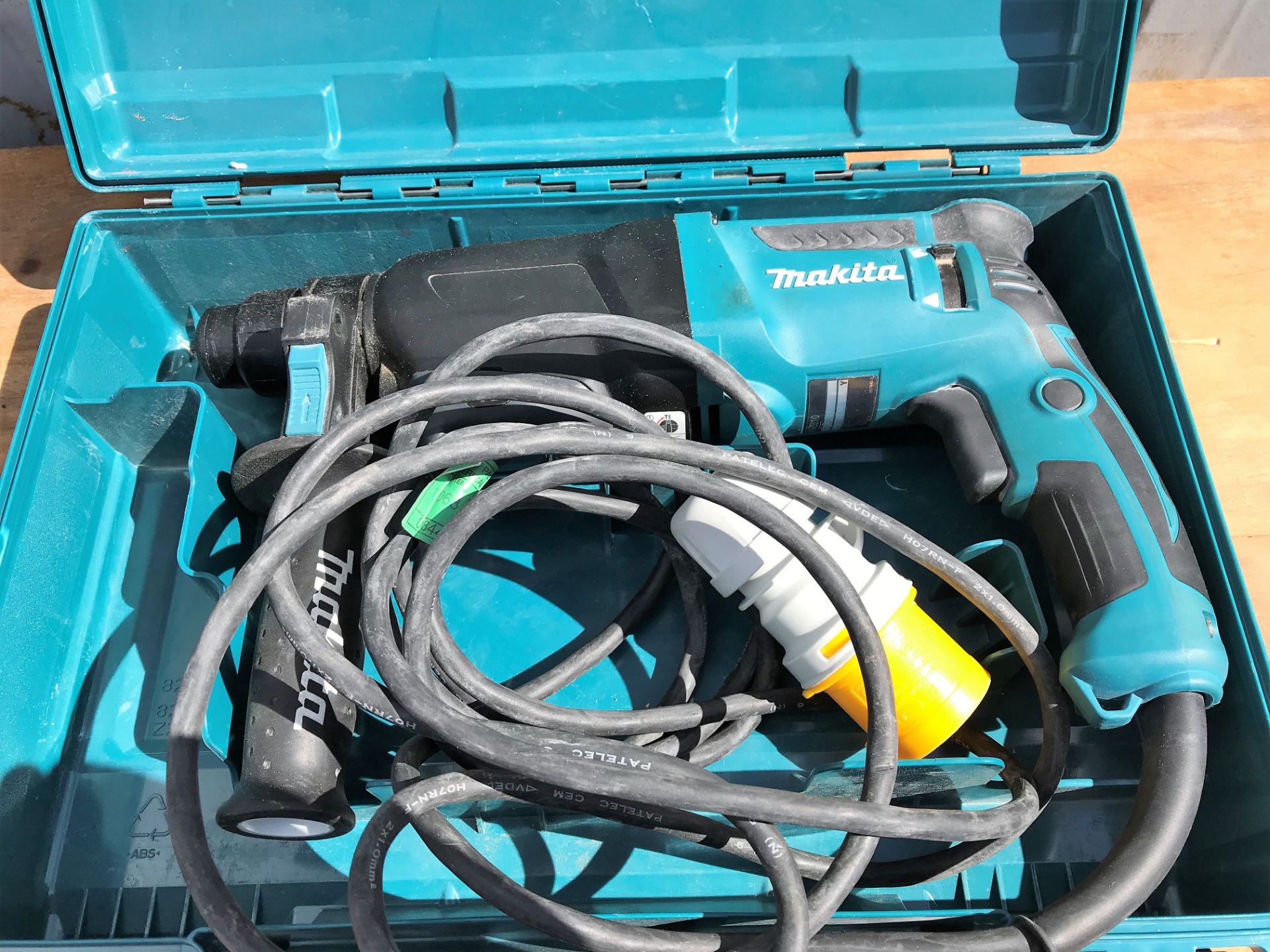 A Makita HR2610 Electric Drill with case, 110v-loc