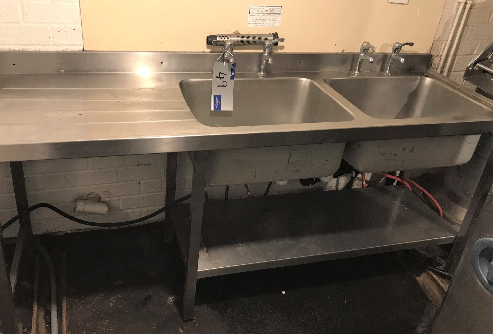 A Stainless Steel Double Bowl Single Drainer Sink