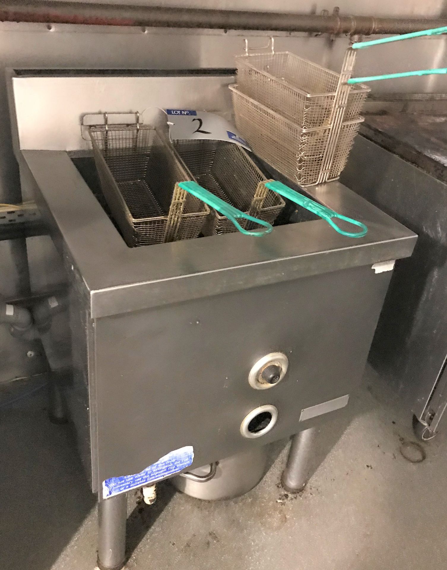 A Gas Fired Twin Deep Fat Fryer with 2 Spare Baske