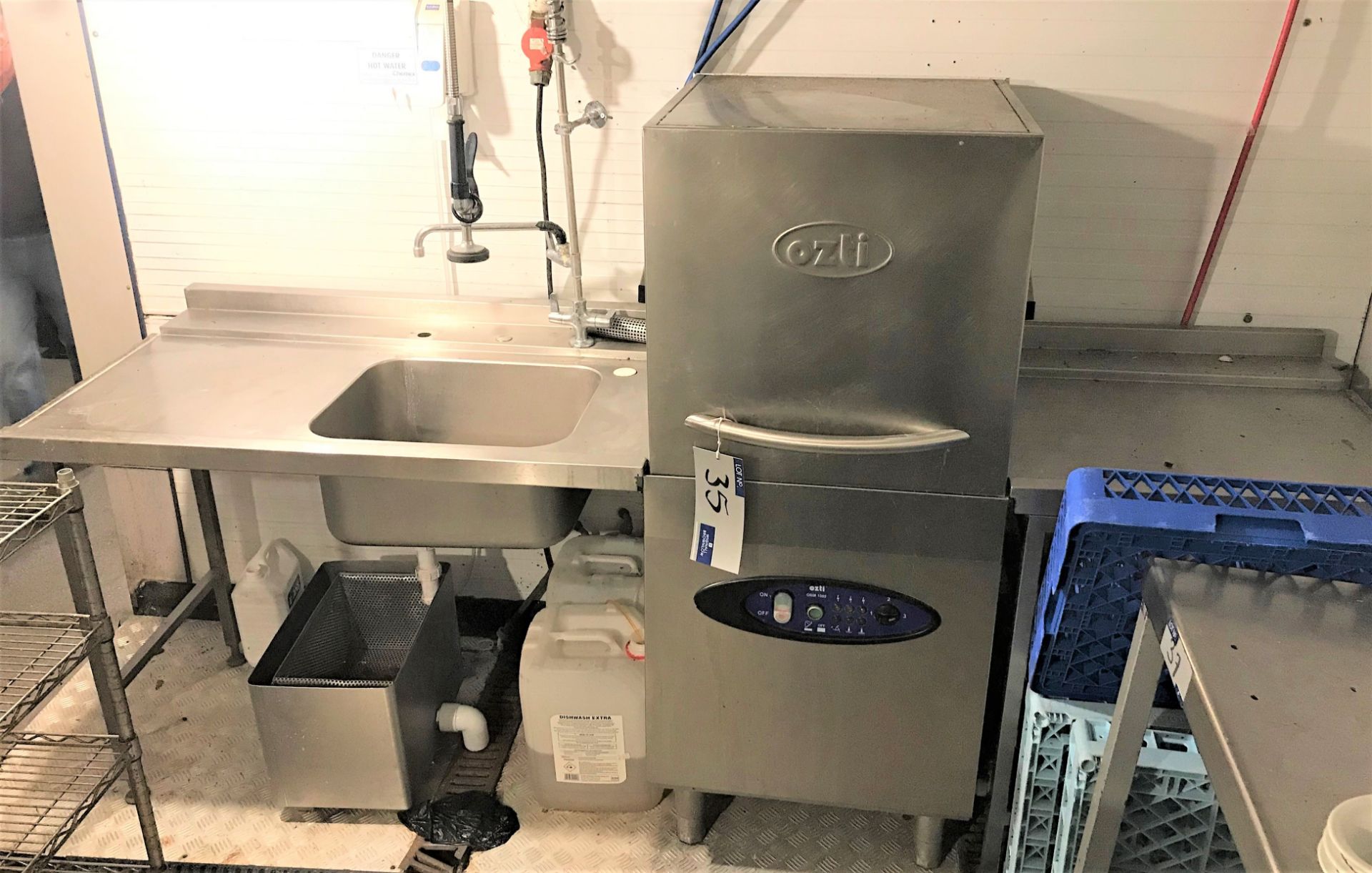 An Ozti OBM1080S Hood Type Dishwasher (2016) with