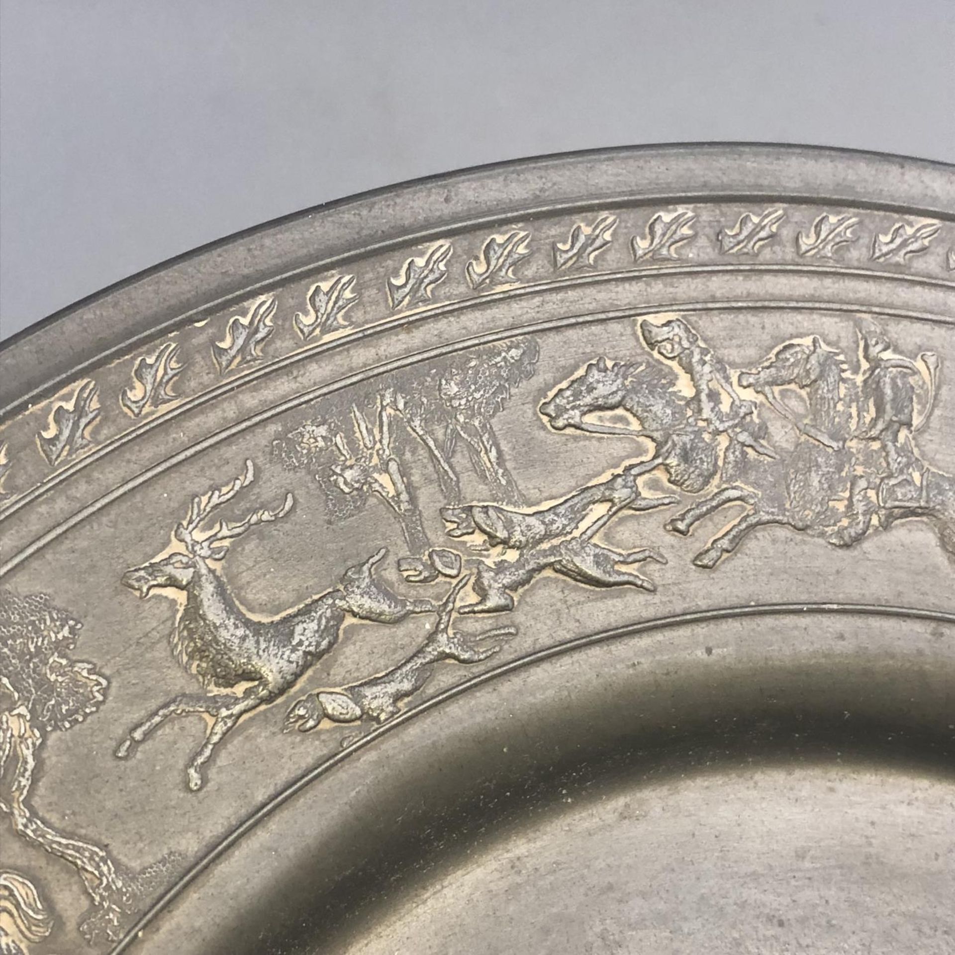 An antique German pewter plate with encircling Stag Hunting scene to border. Touchmarks to base. - Image 7 of 7