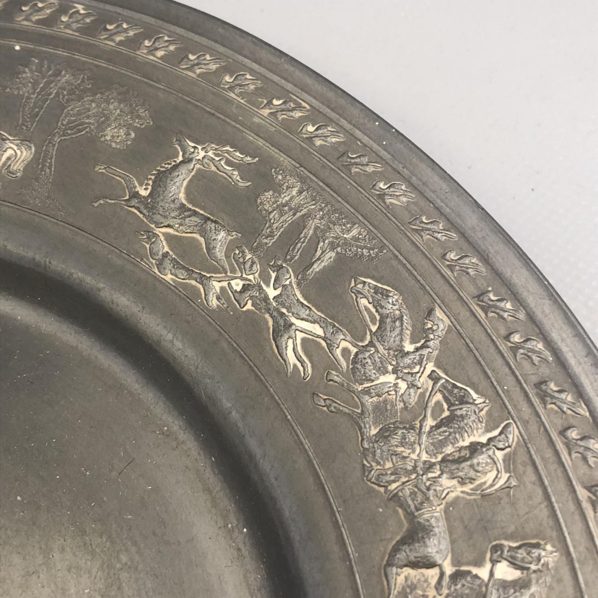 An antique German pewter plate with encircling Stag Hunting scene to border. Touchmarks to base. - Image 2 of 7