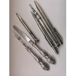 Group Of Pens And A Silver Knife And Fork