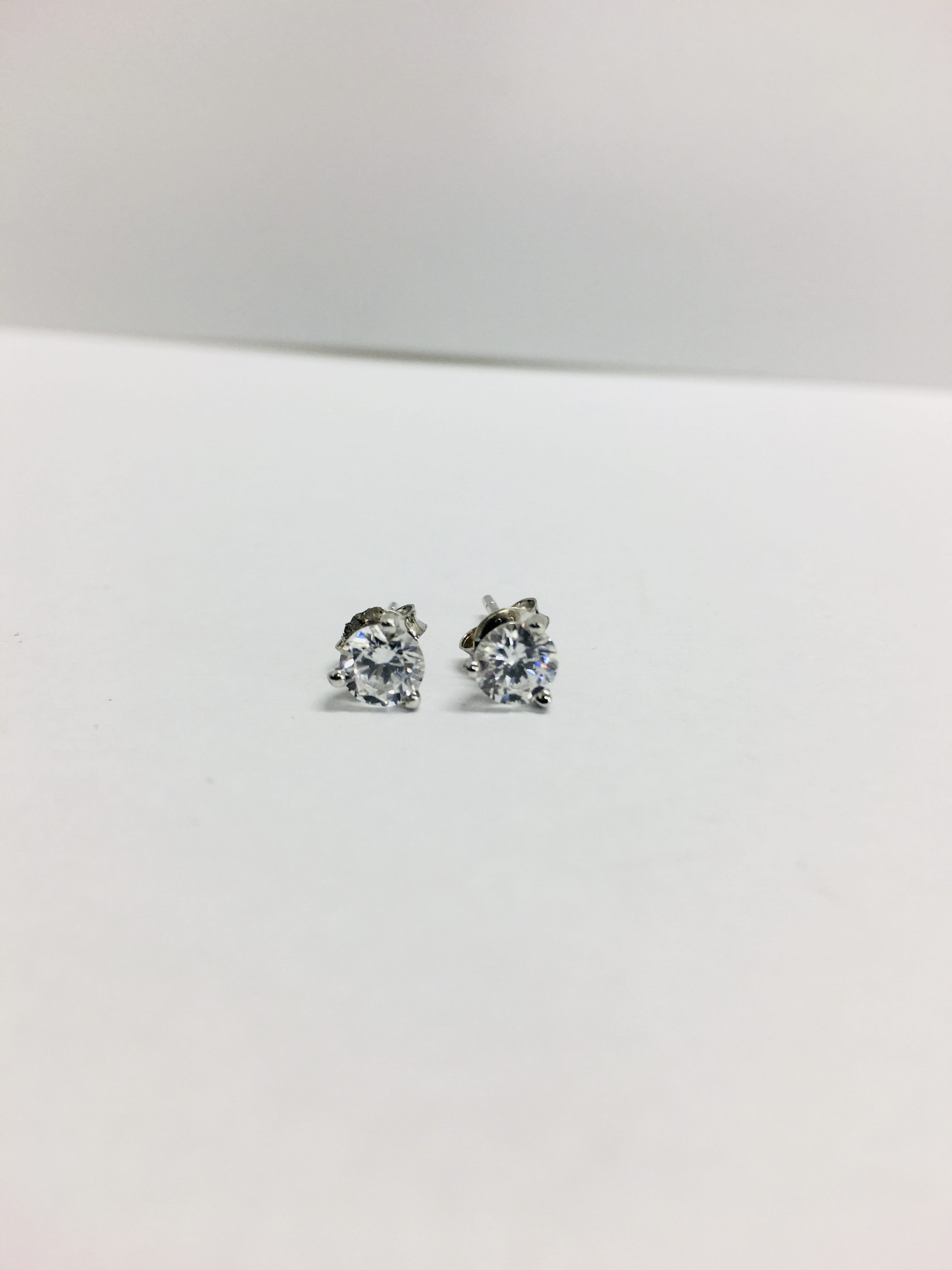 0.70ct diamond solitaire stud earrings set in platinum. I colour, si3 clarity. 3 claw setting with