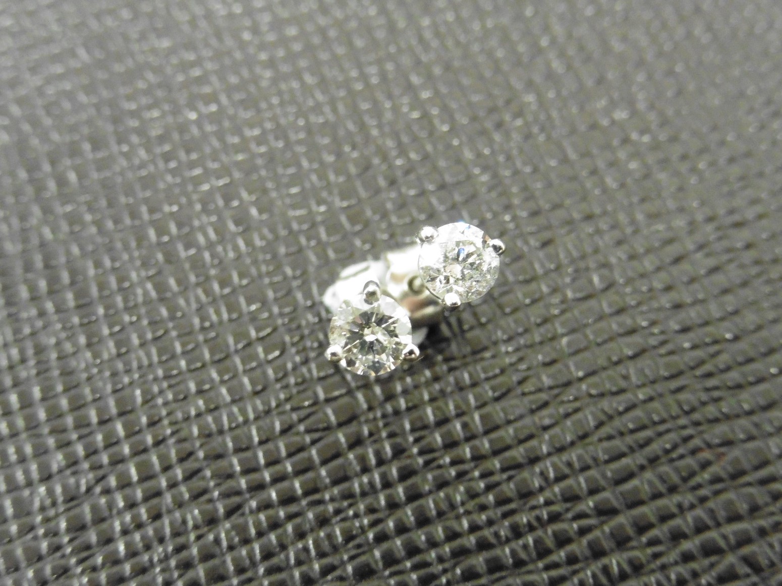 0.33ct diamond solitaire stud earrings set in platinum. I colour, si3 clarity. 3 claw setting with