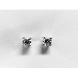 0.66ct Solitaire diamond stud earrings set with brilliant cut diamonds, i1 clarity and I colour. Set