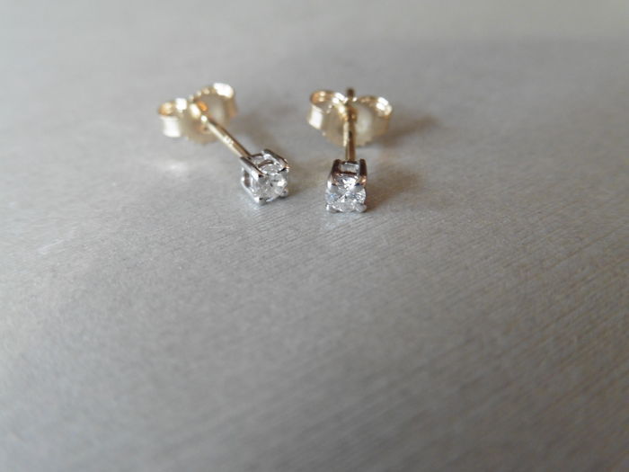 0.10ct Solitaire diamond stud earrings set with brilliant cut diamonds, SI2 clarity and I colour.