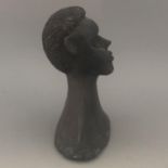A carved clay pottery African figurine sculpture or candle snuffer