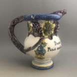 A vintage hand painted French pottery puzzle jug with snake spout