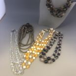 A Collection of 1950s Multi Strand Bead Necklaces (5)