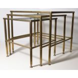 Nest of French Brass glass topped tables.