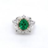 A 2.13 Carat Bespoke Engagement Ring Set In White Gold, Colombian Emerald And Two Dozen Diamonds!