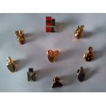 Designer pin/brooches. Collection of 9 Vintage gold and silver tone