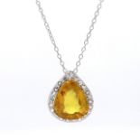 Pear Shaped  Diamond and Yellow Sapphire Halo Pendant in Claw Setting