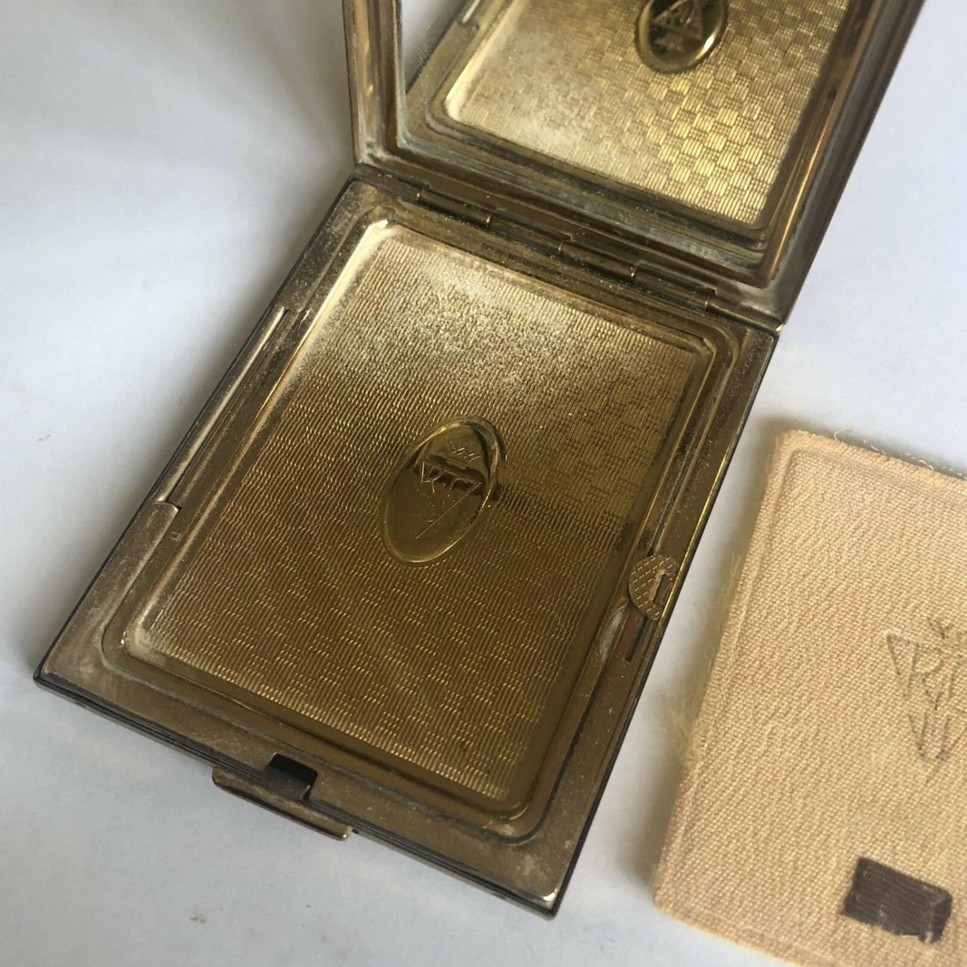 An Art Deco design engine turned gold colour powder rectangular compact by KIGU - Image 4 of 6
