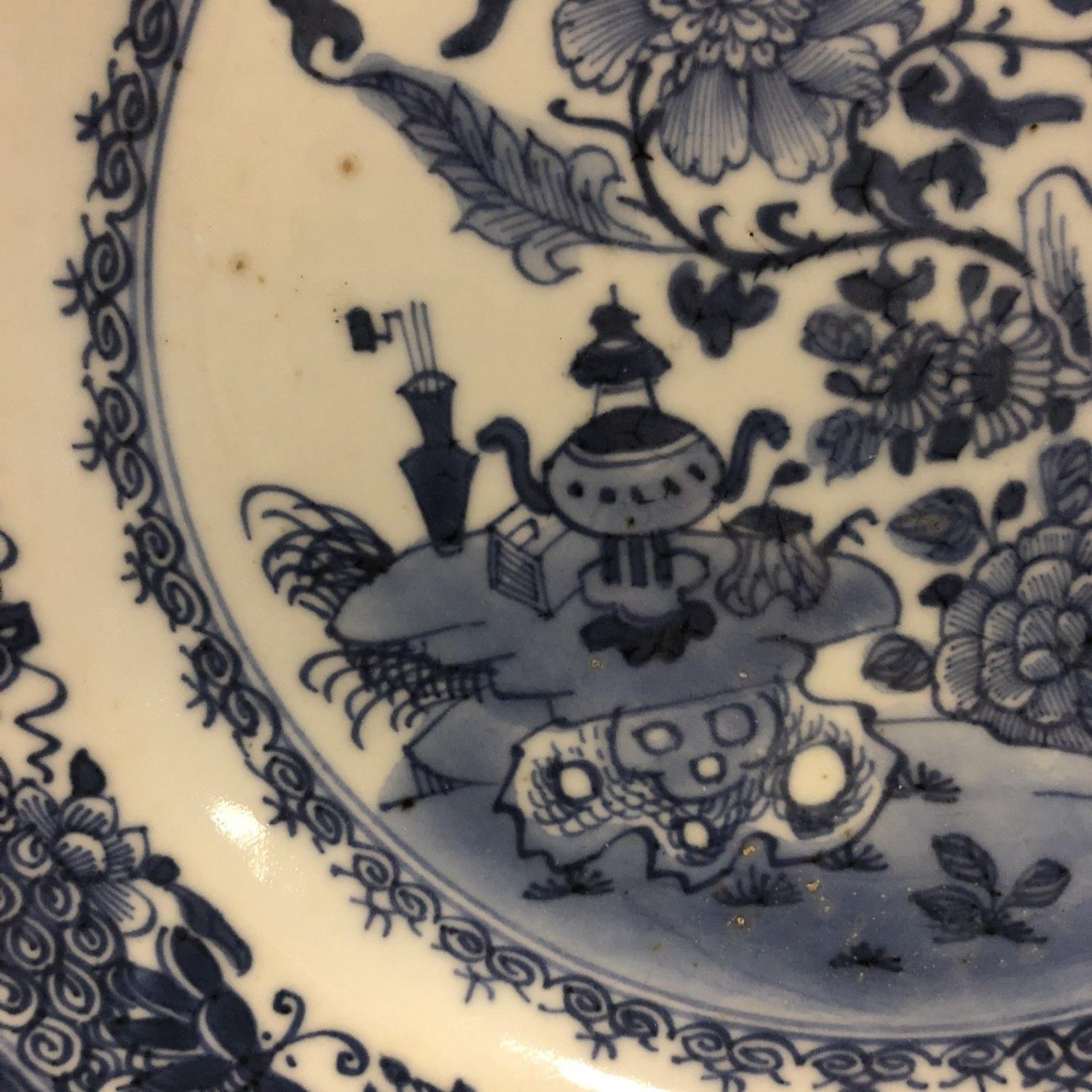 An 18th century Chinese blue and white plate with trees moths & precious objects - Image 3 of 8