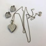 A silver 925 crystal heart pendant on 925 silver chain with matching earrings