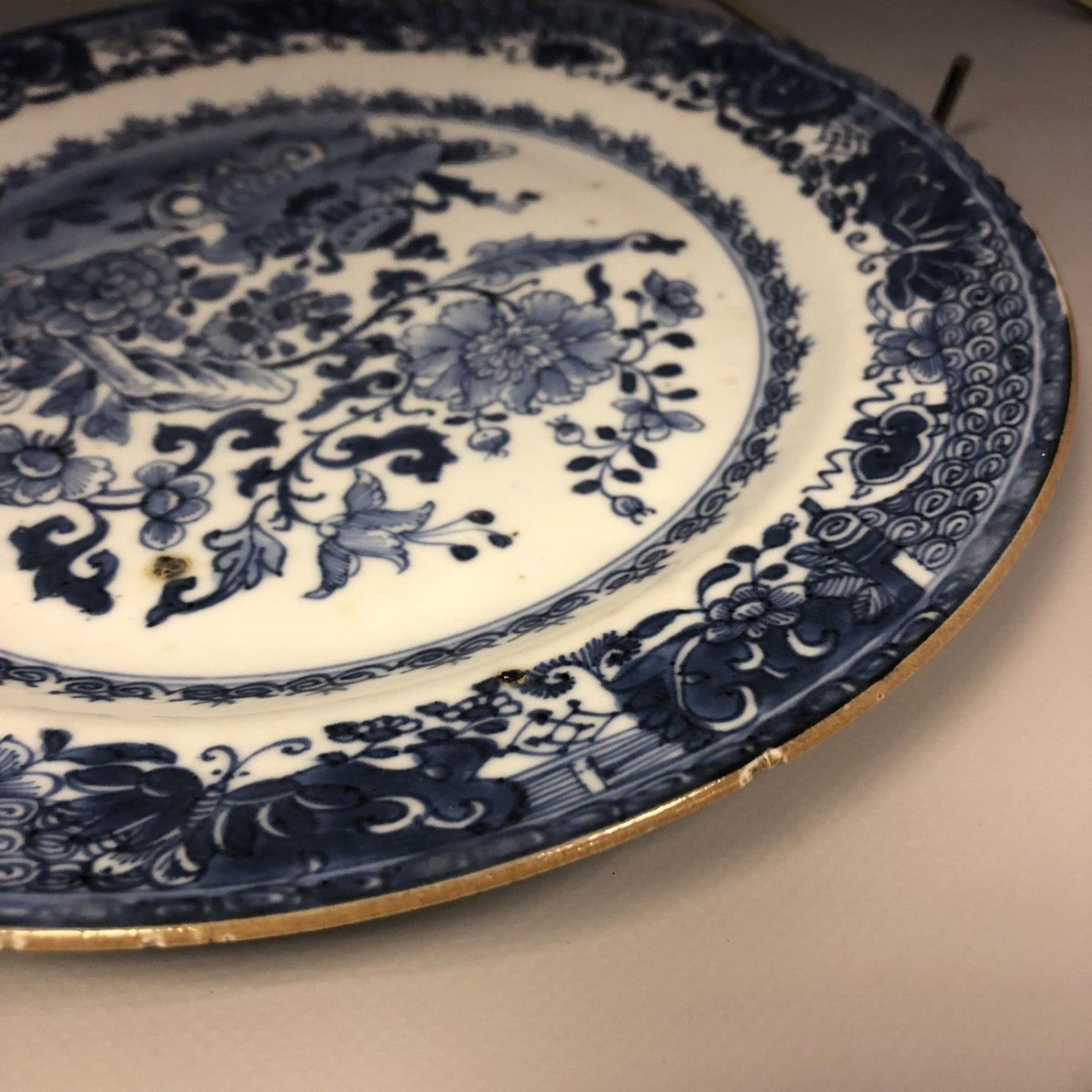 An 18th century Chinese blue and white plate with trees moths & precious objects - Image 6 of 8