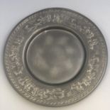 An antique German pewter plate with encircling Stag Hunting scene to border. Touchmarks to base.