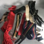 A collection of military uniform belts