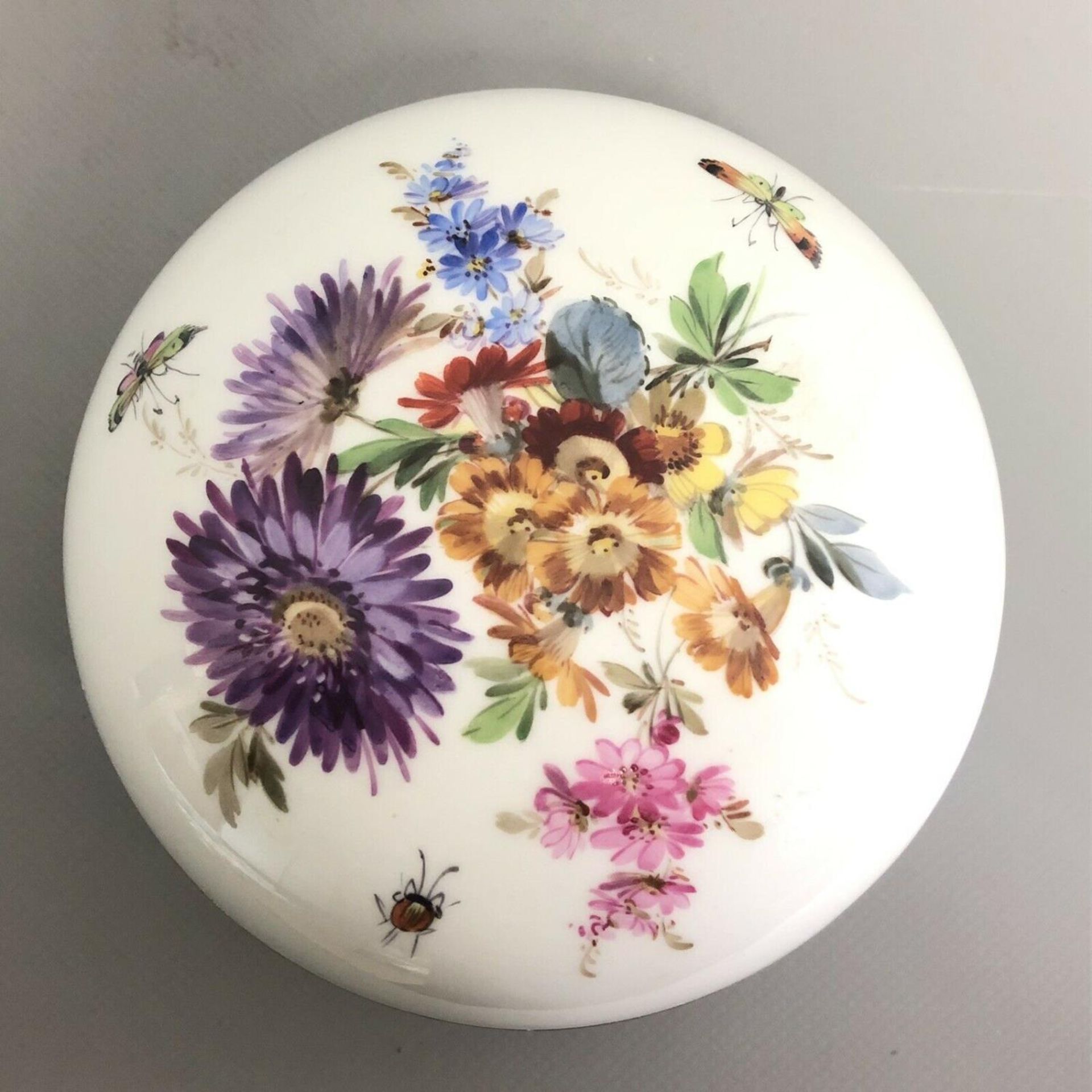 A Dresden porcelain cushion shaped floral decorated powder bowl and cover