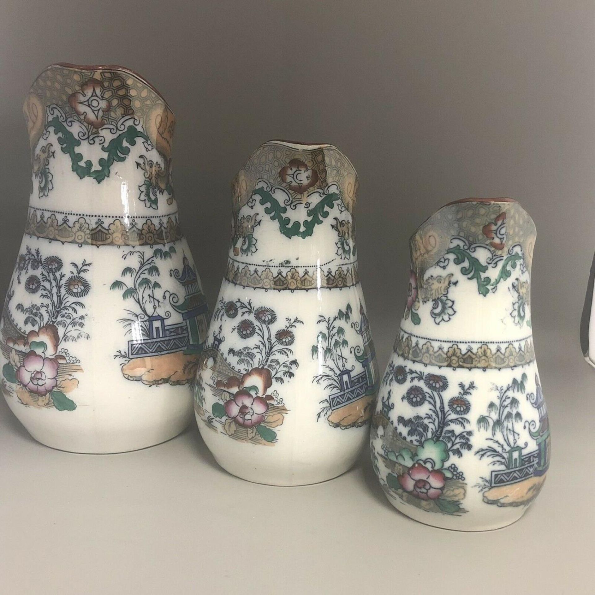 A Set of three 19th Century Graduated Chinoiserie Pottery Dresser Jugs - Image 3 of 9