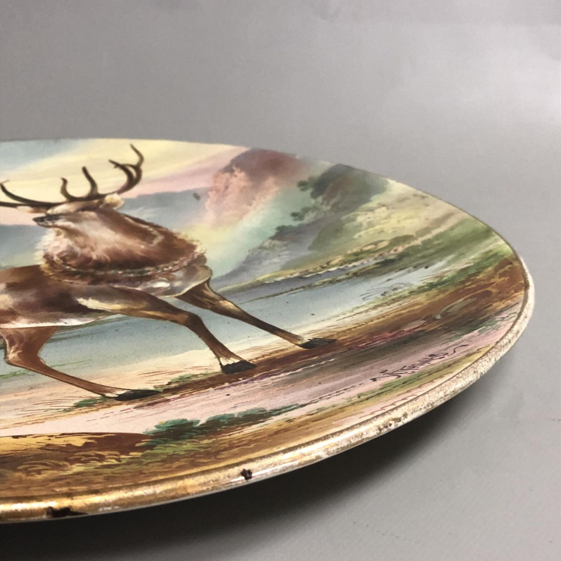 A large antique circular pottery plaque with hand painted scene of a Highland Stag. Signed W Thomas. - Image 6 of 7