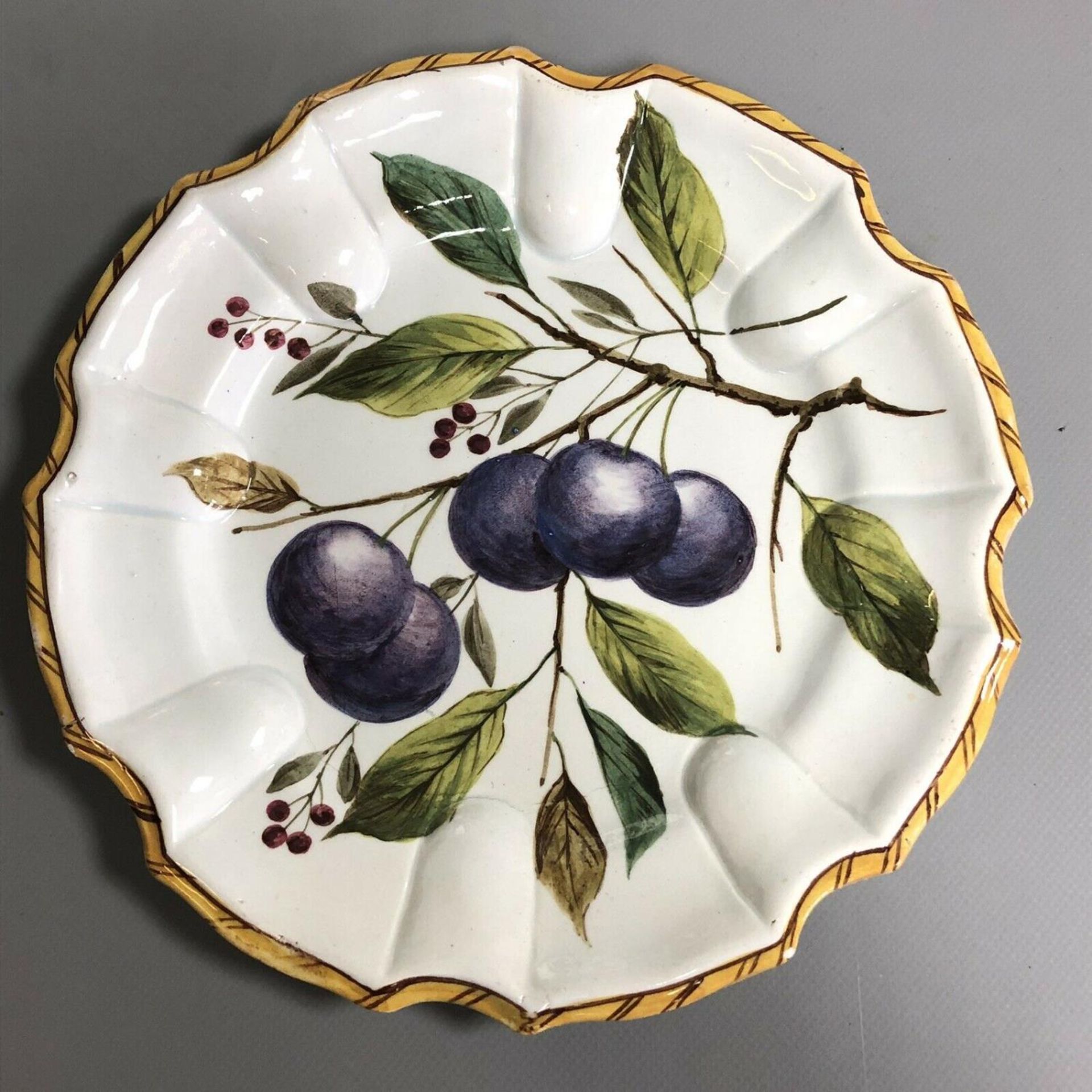 A set of three antique Continental pottery plates hand painted with fruits - Image 2 of 8