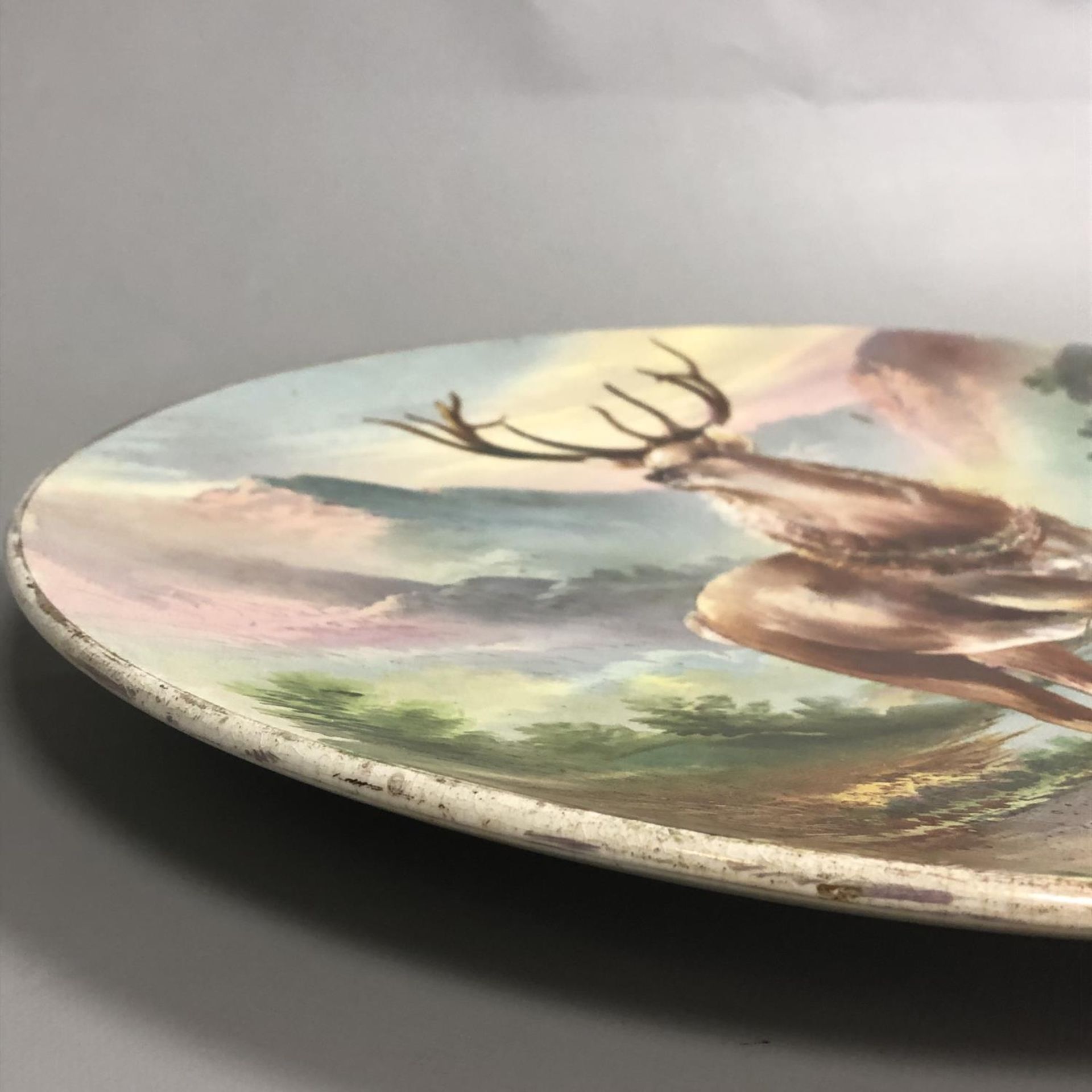 A large antique circular pottery plaque with hand painted scene of a Highland Stag. Signed W Thomas. - Image 4 of 7
