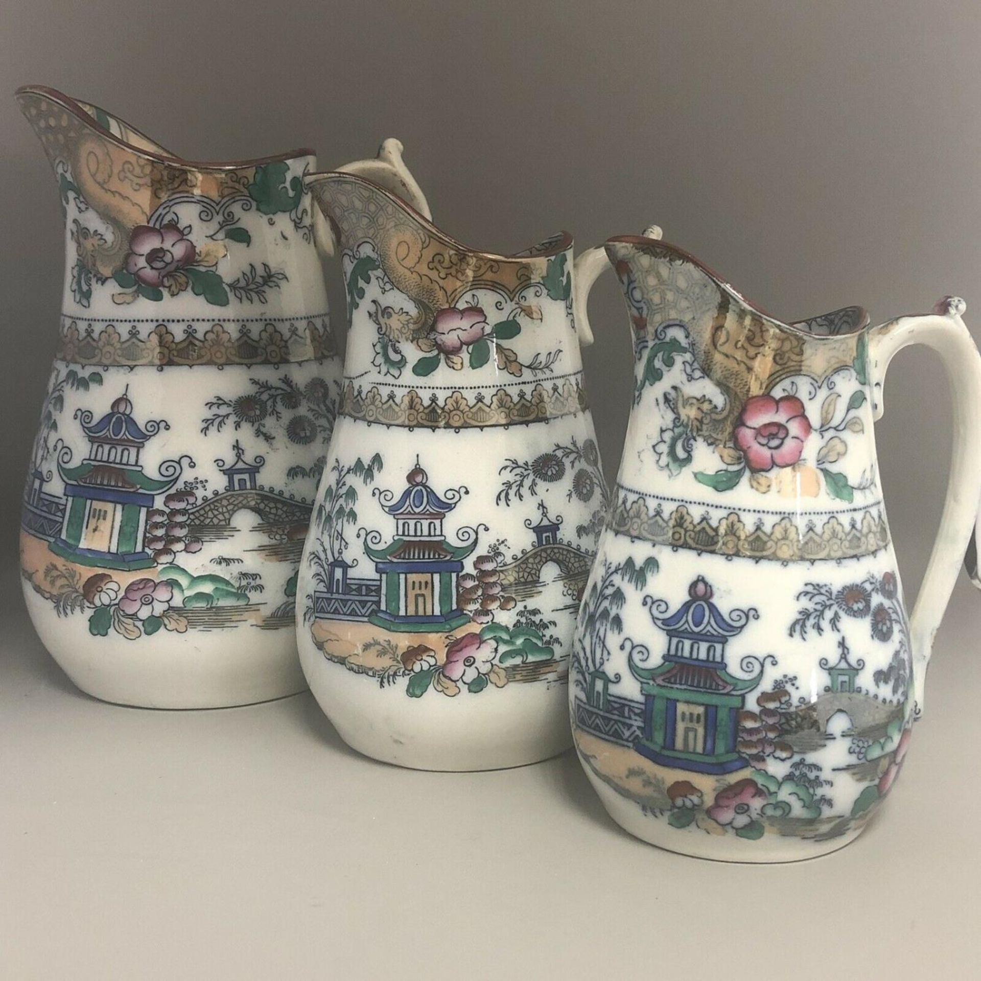 A Set of three 19th Century Graduated Chinoiserie Pottery Dresser Jugs - Image 2 of 9