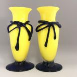 A pair of vintage bright yellow art blown glass vases with blue glass ribbon bows