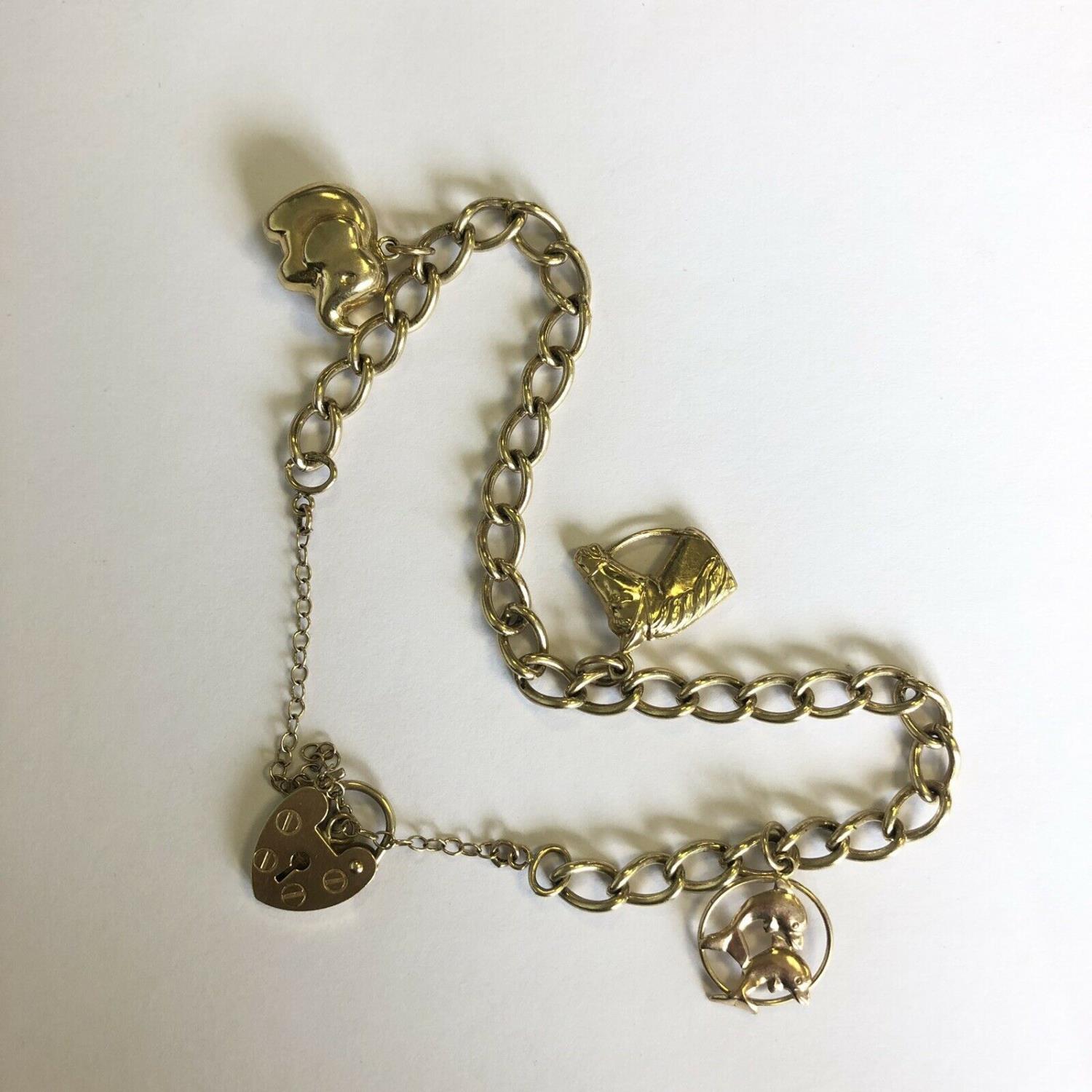 A Vintage Hallmarked 9ct Yellow Gold Charm Bracelet with padlock & 3 charms