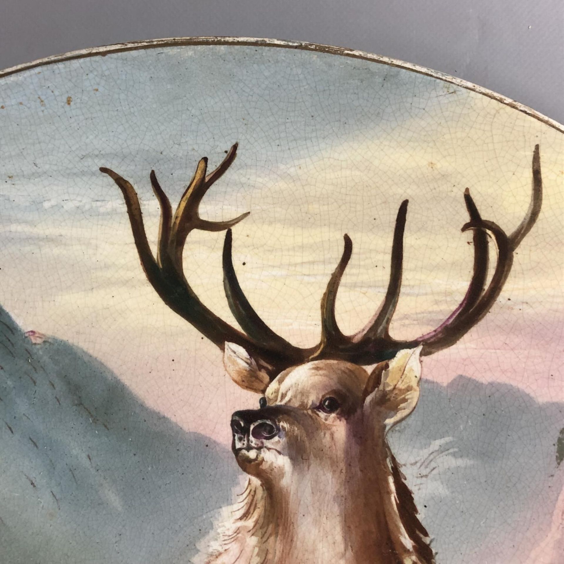 A large antique circular pottery plaque with hand painted scene of a Highland Stag. Signed W Thomas. - Image 3 of 7