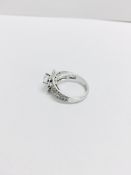 1.04ct diamond set soliatire ring in platinum. H colour and I1 clarity. Halo setting small