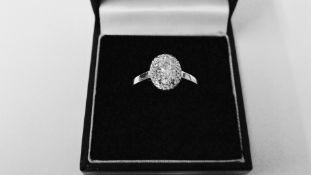 0.95ct diamond set solitaire ring set in platinum. Oval cut diamond, I colour and VS clarity,