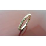 0.50ct full claw set diamond band ring set in 9ct yellow gold. Ring size M. I colour and i1 clarity.