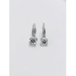 18ct white gold hoop style earrings with hinge fastners. 2 x 0.50ct Brilliant cut diamonds, i colour