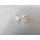 1.90ct Diamond solitaire earrings set with brilliant cut diamonds, I colour I1 clarity. Four claw