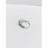 1.04ct diamond set soliatire ring in platinum. H colour and I1 clarity. Halo setting small