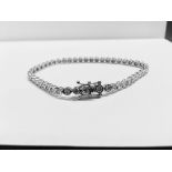 5.60ct diamond tennis style bracelet set with brilliant cut diamonds, I colour, Si2 clarity. 18ct