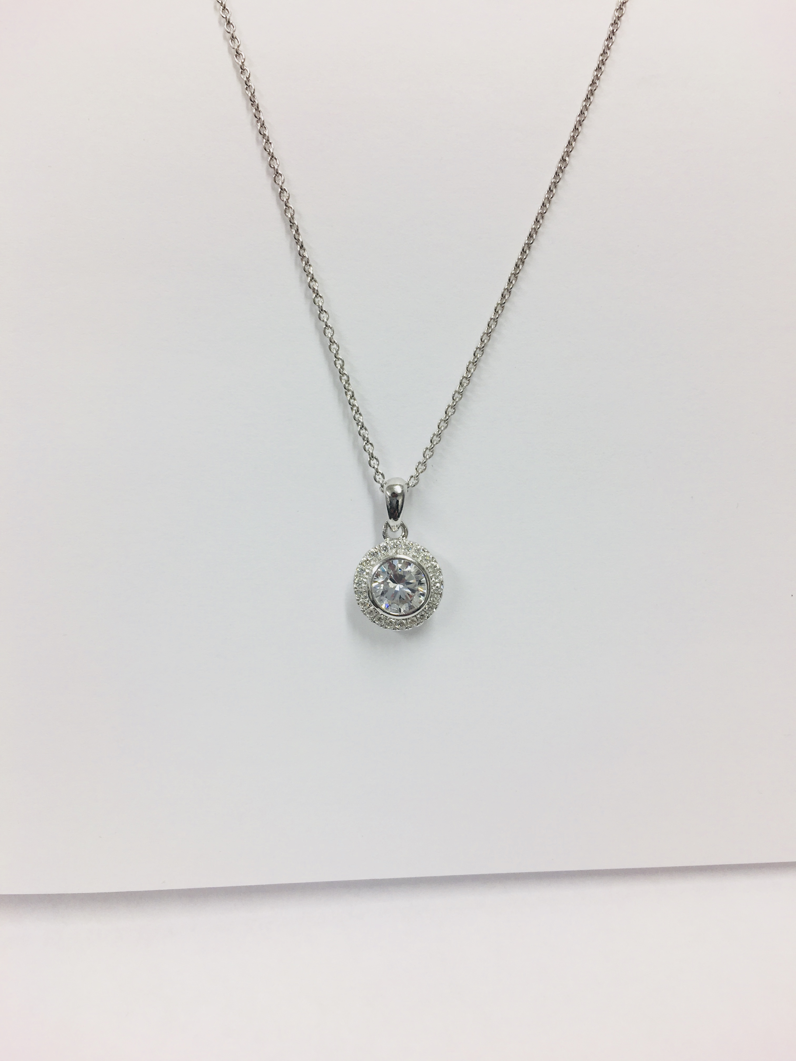 0.50ct diamond set pendant. Brilliant cut diamond Hcolour, si1 clarity. Halo setting with diamonds